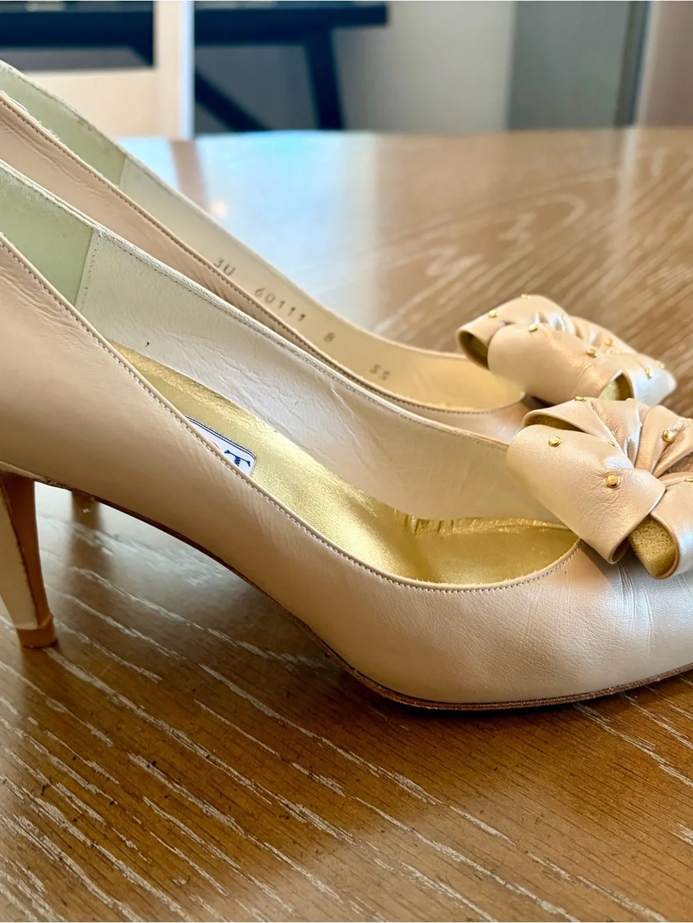 Stuart Weitzman Pearl Bow Pointy Pumps in Light Beige with Gold Studs